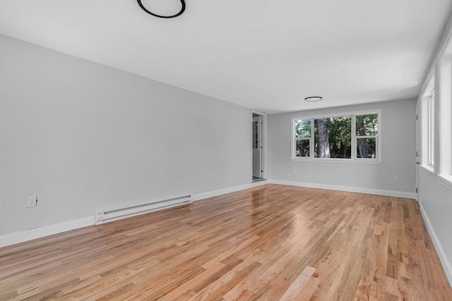 46 Curtis St, Brockton, MA 02301 - unfurnished room with a baseboard radiator and light wood-type flooring