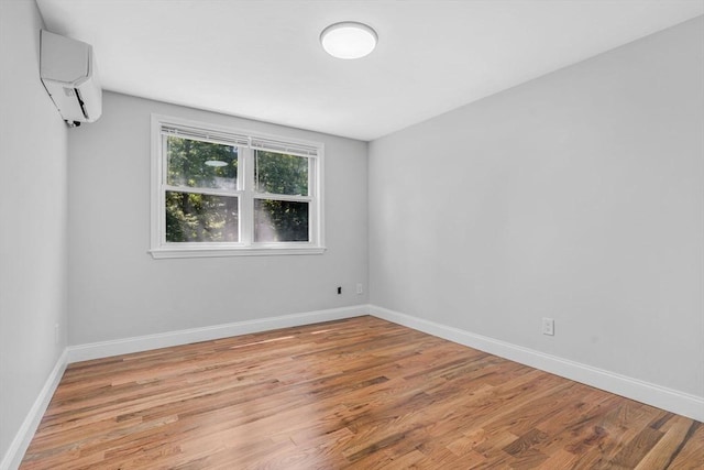 46 Curtis St, Brockton, MA 02301 - unfurnished room with light wood-style floors and an AC wall unit