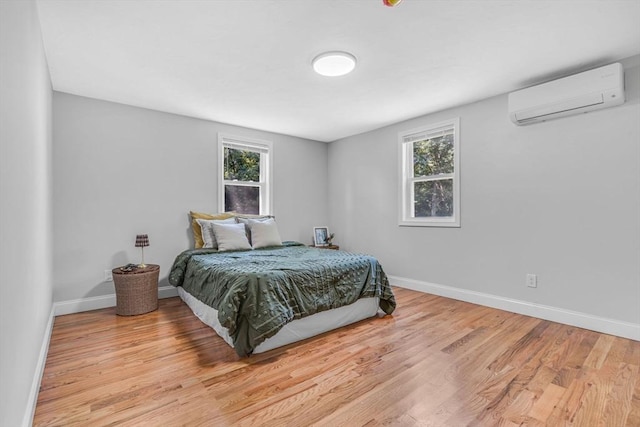 46 Curtis St, Brockton, MA 02301 - bedroom with an AC wall unit and light wood finished floors