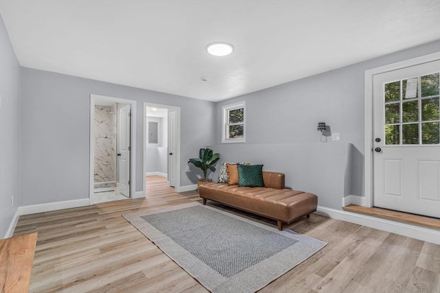46 Curtis St, Brockton, MA 02301 - living area with baseboards and light wood-style flooring