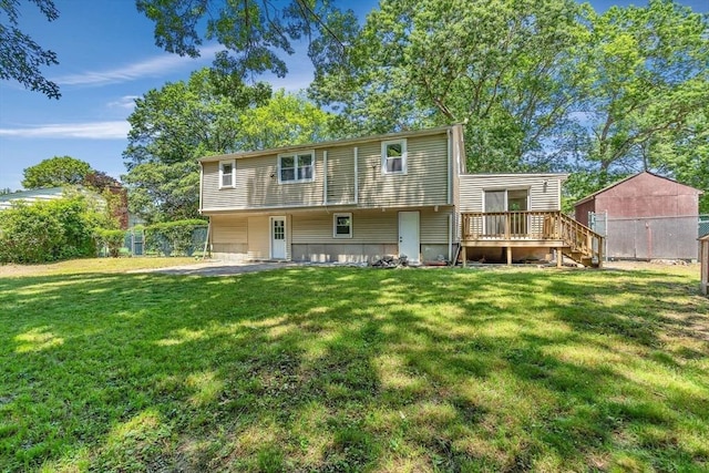 46 Curtis St, Brockton, MA 02301 - back of property with a deck and a lawn