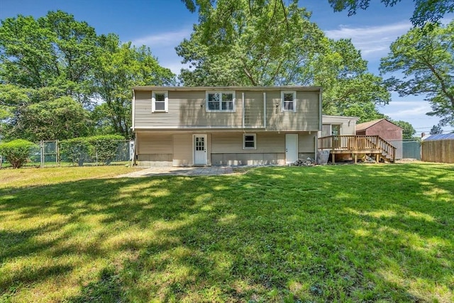 46 Curtis St, Brockton, MA 02301 - back of house with a fenced backyard and a deck