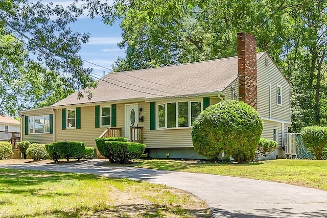 46 Curtis St, Brockton, MA 02301 - view of front of house with a chimney and a front lawn