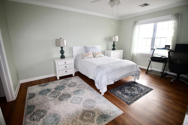 bedroom with dark hardwood / wood-style floors, ceiling fan, and crown molding