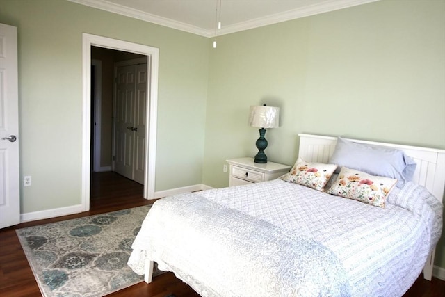 bedroom featuring dark hardwood / wood-style flooring and ornamental molding