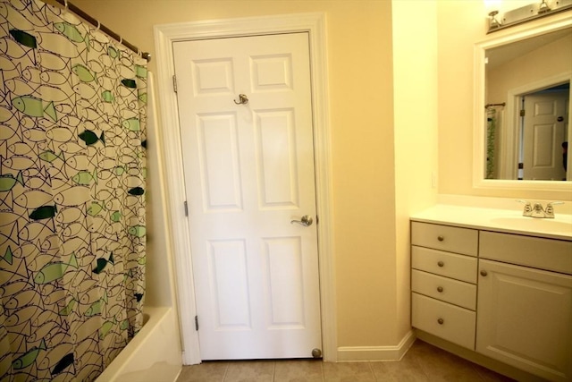 bathroom with tile patterned floors, vanity, and shower / bathtub combination with curtain