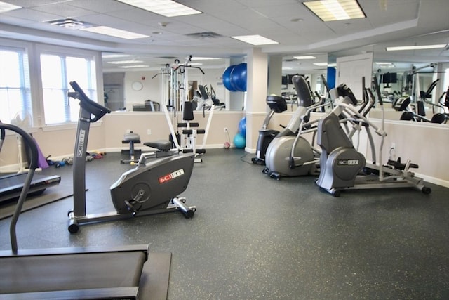 exercise room featuring a drop ceiling