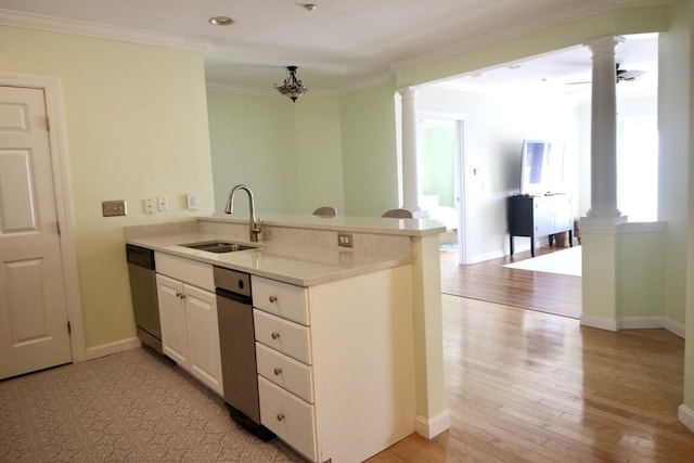 kitchen with kitchen peninsula, dishwasher, light hardwood / wood-style floors, and sink