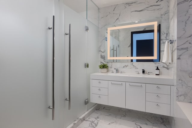 bathroom featuring vanity, tile floors, and tile walls