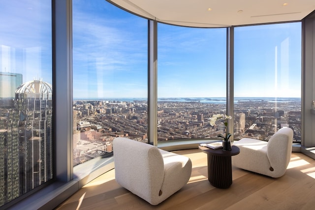 interior space featuring a wall of windows and light hardwood / wood-style flooring