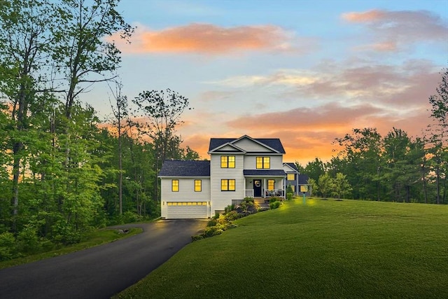 182 Sheldon Rd, Fitchburg, MA 01420 - view of front of home featuring driveway, a yard, and an attached garage