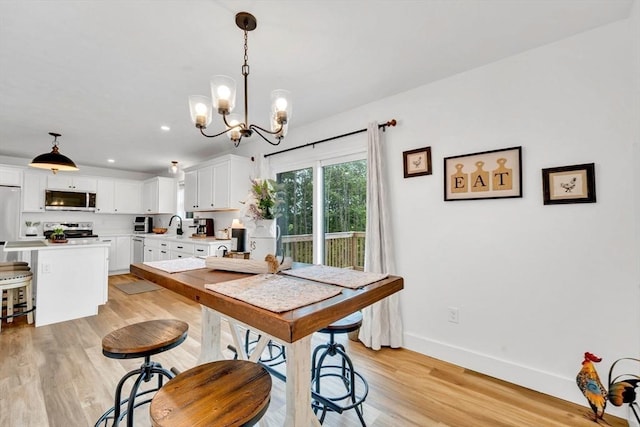 182 Sheldon Rd, Fitchburg, MA 01420 - dining room featuring a chandelier, light wood-style flooring, and recessed lighting