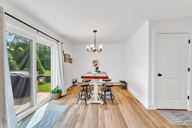 182 Sheldon Rd, Fitchburg, MA 01420 - dining area with light wood finished floors and a chandelier