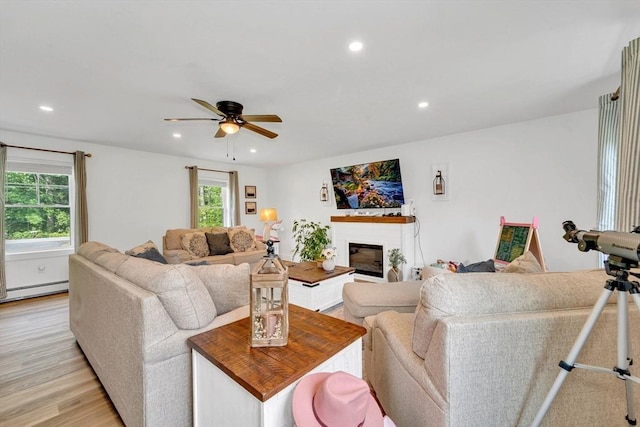 182 Sheldon Rd, Fitchburg, MA 01420 - living area featuring recessed lighting, ceiling fan, a glass covered fireplace, and light wood-style flooring