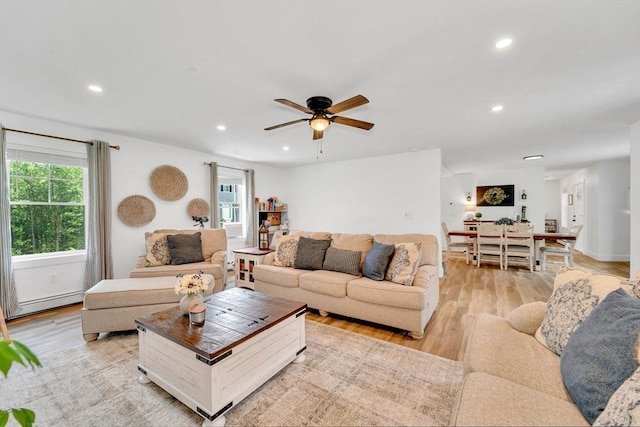 182 Sheldon Rd, Fitchburg, MA 01420 - living room featuring a baseboard heating unit, light wood-type flooring, recessed lighting, and ceiling fan