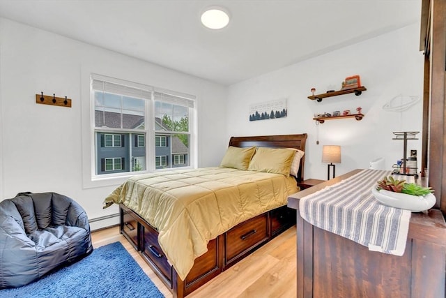 182 Sheldon Rd, Fitchburg, MA 01420 - bedroom with light wood finished floors and a baseboard radiator