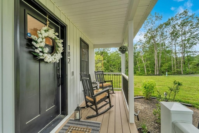 182 Sheldon Rd, Fitchburg, MA 01420 - wooden porch featuring a yard
