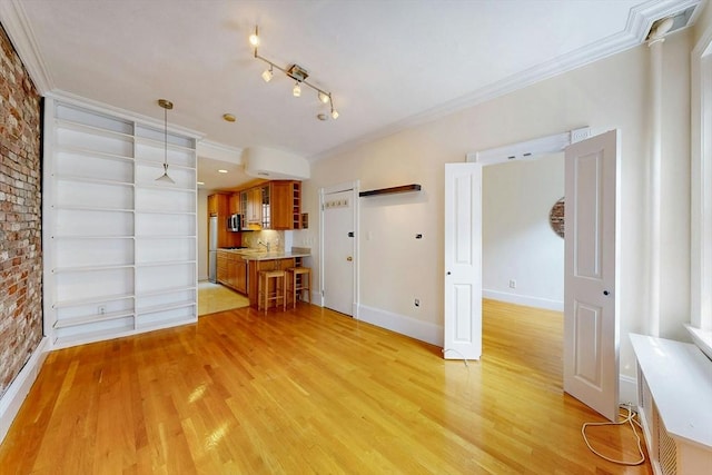 11 Irving St Unit 4, Boston, MA 02114 - unfurnished living room featuring crown molding, light wood-type flooring, baseboards, and built in features