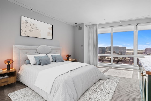 bedroom with light colored carpet