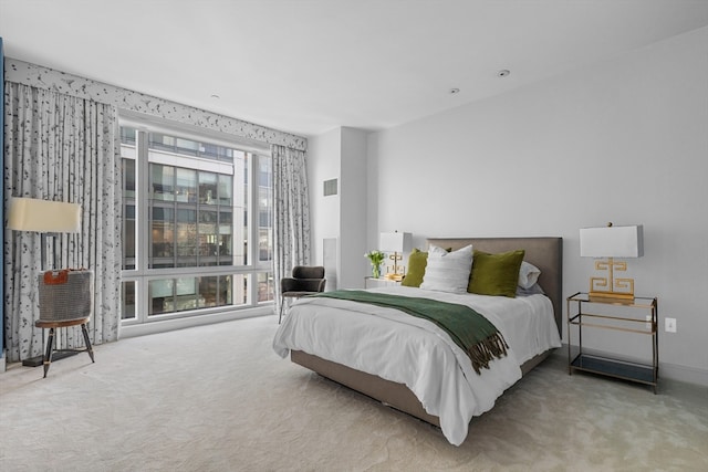 carpeted bedroom with multiple windows