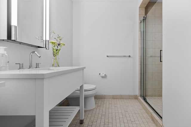 bathroom with tile patterned floors, walk in shower, toilet, and vanity