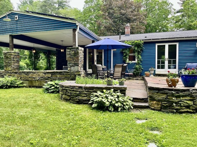947 Burts Pit Rd, Northampton, MA 01062 - rear view of property with french doors, a yard, a patio, and a chimney