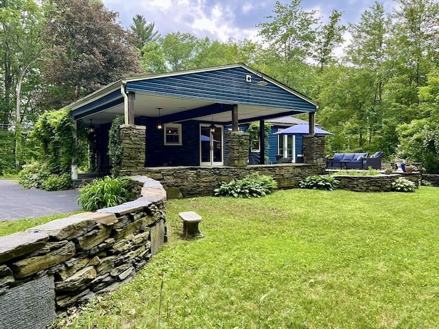 947 Burts Pit Rd, Northampton, MA 01062 - view of front of home with an outdoor hangout area, a front yard, a porch, and stone siding