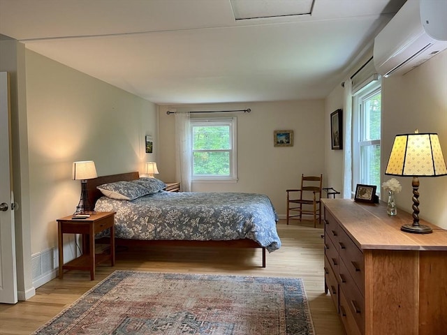 947 Burts Pit Rd, Northampton, MA 01062 - bedroom featuring a wall unit AC and light wood finished floors