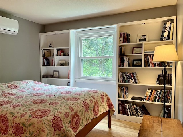 947 Burts Pit Rd, Northampton, MA 01062 - bedroom with a wall unit AC and wood finished floors