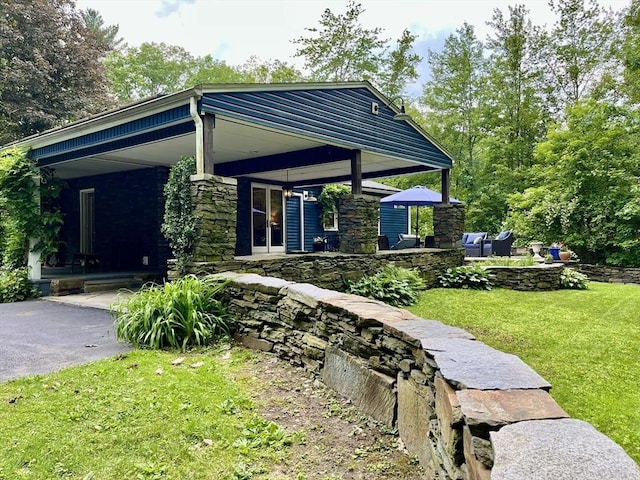 947 Burts Pit Rd, Northampton, MA 01062 - view of front of property featuring a front lawn, covered porch, and stone siding