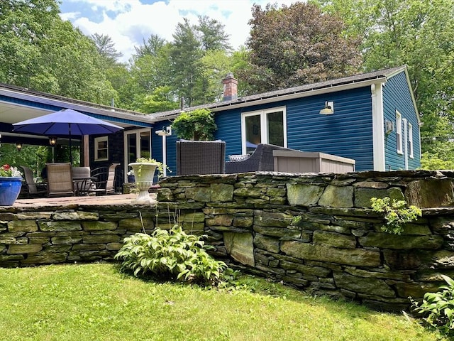 947 Burts Pit Rd, Northampton, MA 01062 - back of property featuring a chimney and a patio area