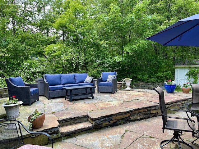 947 Burts Pit Rd, Northampton, MA 01062 - view of patio with an outdoor living space and a wooded view