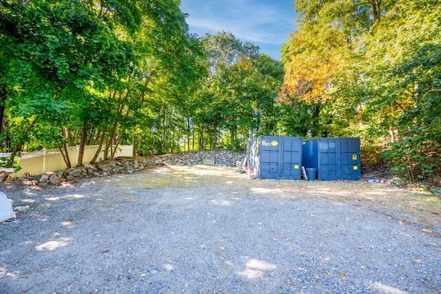 view of gate featuring a storage shed