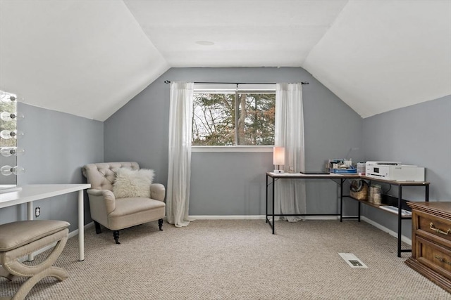 office area with light carpet and vaulted ceiling