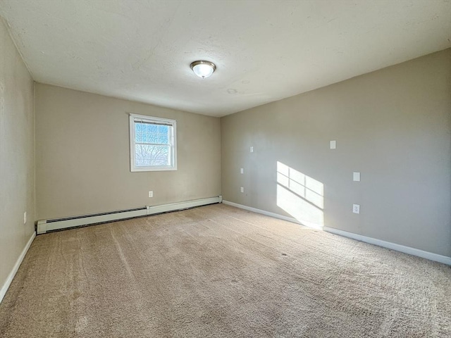 carpeted spare room featuring baseboard heating