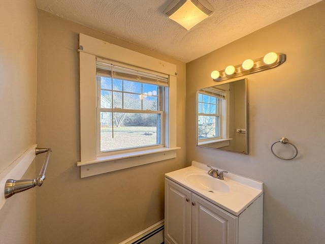 bathroom with vanity and a textured ceiling