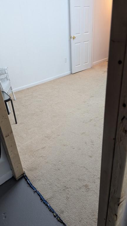 92 Santuit Pond Rd, Mashpee, MA 02649 - unfurnished room featuring carpet floors and baseboards