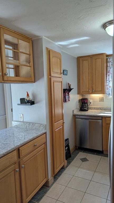 92 Santuit Pond Rd, Mashpee, MA 02649 - kitchen with dishwasher, light tile patterned flooring, light stone countertops, and backsplash