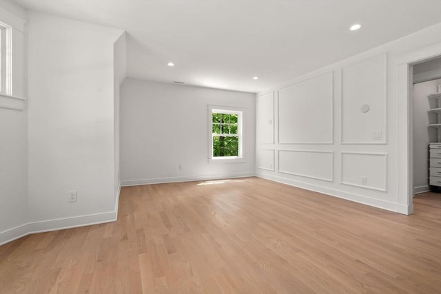 61 Westbourne Rd, Newton, MA 02459 - empty room with light wood-type flooring, recessed lighting, and baseboards