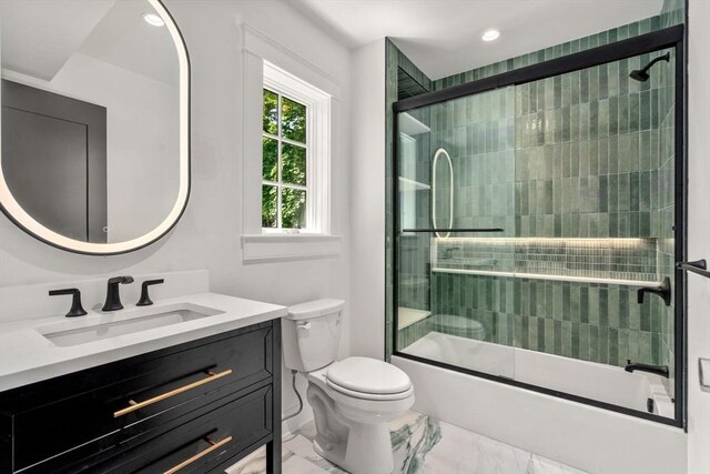 61 Westbourne Rd, Newton, MA 02459 - bathroom featuring vanity, shower / bath combination with glass door, marble finish flooring, toilet, and recessed lighting