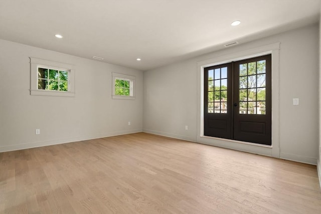 61 Westbourne Rd, Newton, MA 02459 - empty room featuring light wood-style floors, french doors, baseboards, and recessed lighting