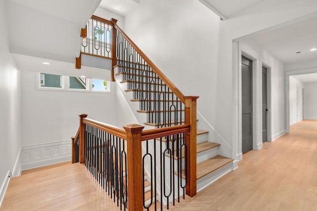 61 Westbourne Rd, Newton, MA 02459 - staircase featuring wood finished floors, baseboards, and recessed lighting