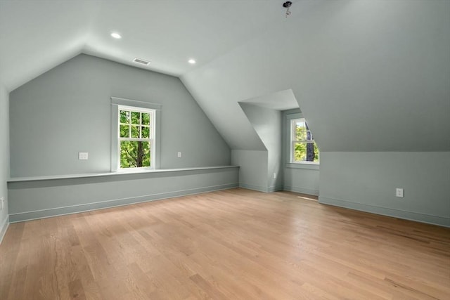 61 Westbourne Rd, Newton, MA 02459 - additional living space featuring lofted ceiling, light wood finished floors, baseboards, and recessed lighting