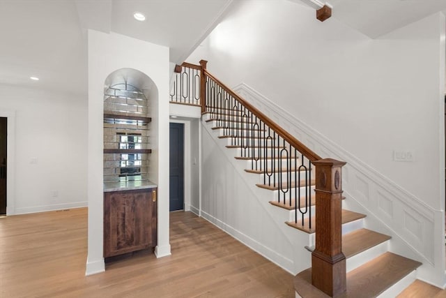 61 Westbourne Rd, Newton, MA 02459 - stairway with wood finished floors, recessed lighting, and baseboards