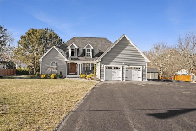 view of front of property with a front lawn and a garage