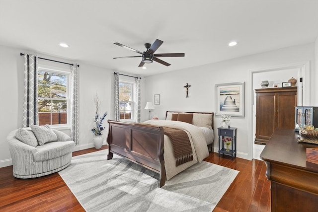 bedroom featuring ceiling fan and dark hardwood / wood-style floors