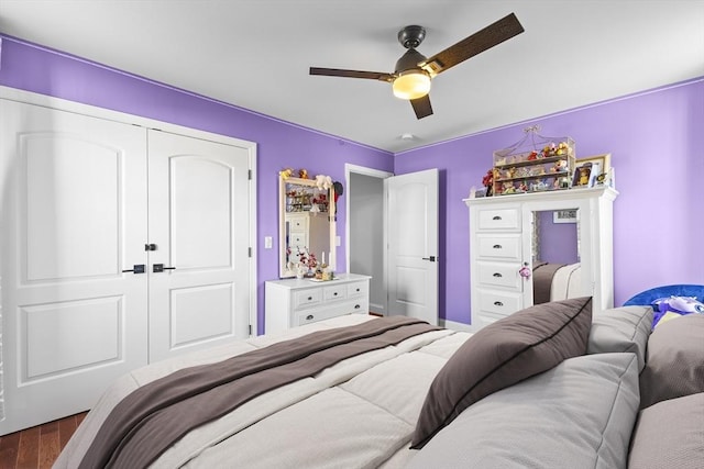 bedroom featuring ceiling fan, a closet, and hardwood / wood-style floors