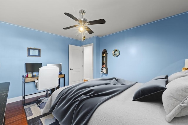 bedroom with ceiling fan and dark wood-type flooring