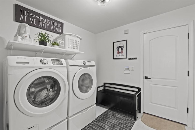 laundry room featuring washing machine and clothes dryer