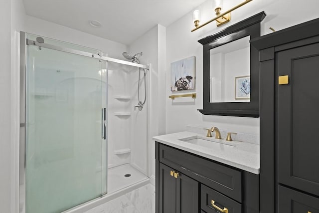 bathroom featuring an enclosed shower and vanity